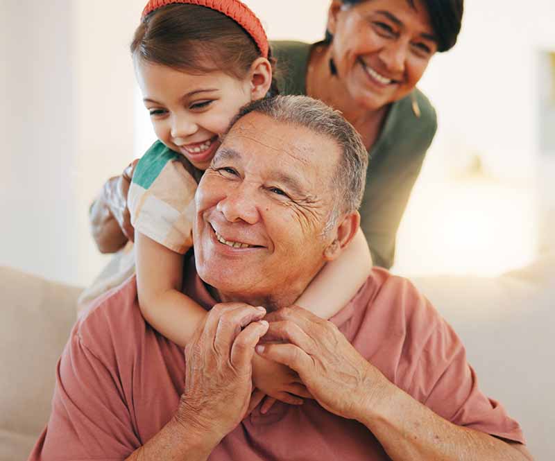 Grandparents playing with granddaughter