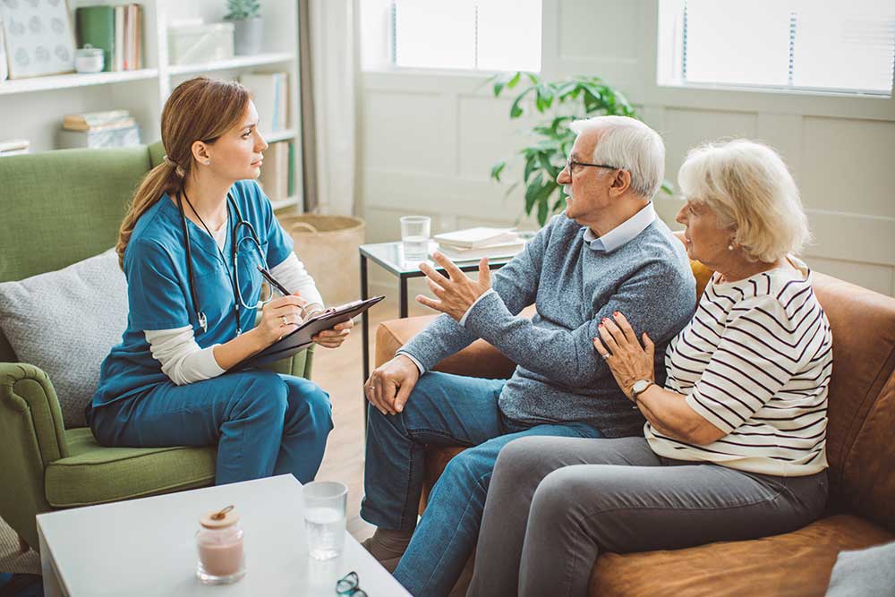 Senior couple talking with healthcare provider